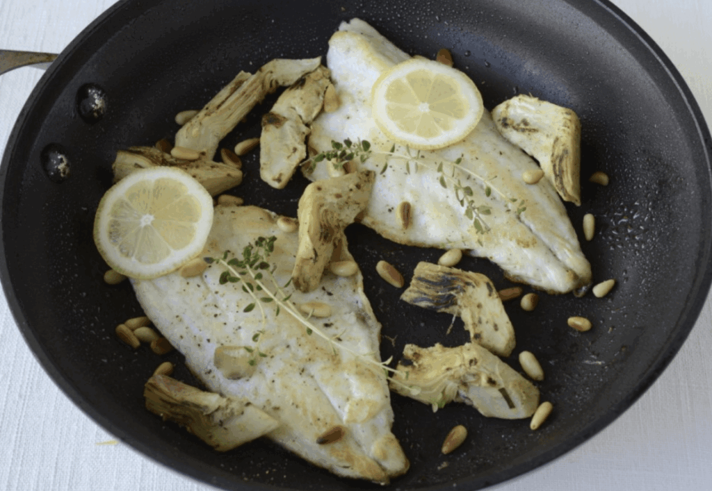 Mediterranean Sea Bass With Pine Nuts, Olives, & Artichokes
