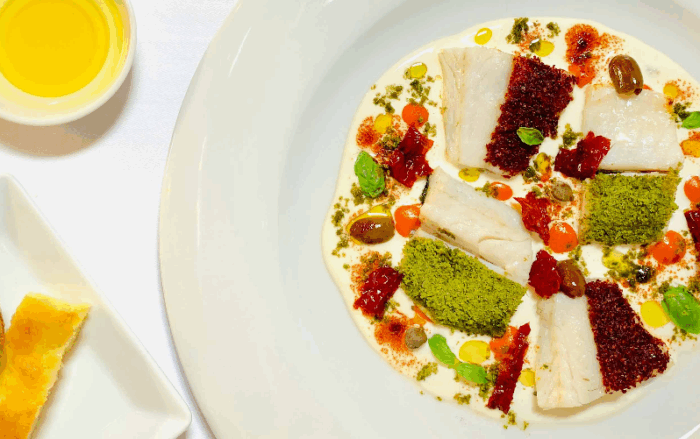 Spigola in olio cottura in fantasia mediterranea