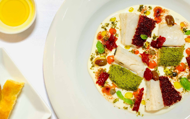 Spigola in olio cottura in fantasia mediterranea