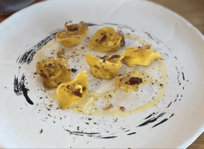 Ravioli all’olio, guanciale e cardoncello